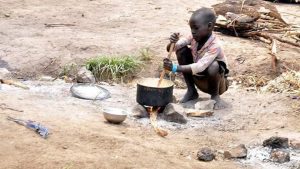 Little-Girl-Cooking-After-Boko-Haram-Killed-Parents.