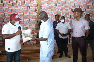 Commissioner of Bureau for Special Duties, Mr. Omamofe Pirah (middle); Commissioner for Information, Mr. Charles Aniagwu (right) receiving donated food Items from the Managing Director Jayta Petroleum Commodities Nigeria Limited, Mr. Emmanuel Onyenweliakuba, during the Food Bank Inspection, at Agricultural Development Authority (ADP), Ibusa, PIX: JIBUNOR SAMUEL.