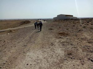 Delta Pilgrims climbing to the hilltop housing the demolished palace of king Herold.