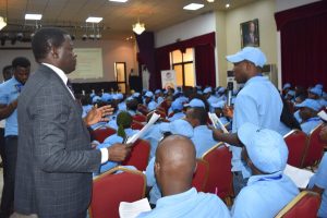 Resource person, Pastor Afolabi Adun, interacting with a trainee